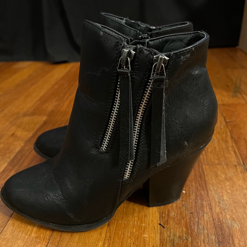 Black booties with zipper detail
